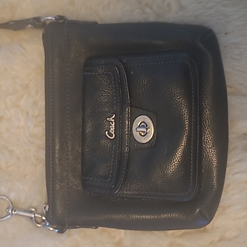 Coach black small shoulder or cross body purse.